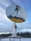 Satellite dish in Inuvik, Northwest Territories, Canada. It depicts a 'long-range scanning system' developed by Inuit peoples in the region, who would boost people up to look for animals. (Photo: Rob McMahon).