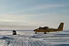 A Royal Canadian DHC-6 Twin Otter aircraft waits on a runway after delivering supplies and personnel to Ice Camp Skate during ICEX 2018. (Source: U.S. Navy/ Kelly Willett)
